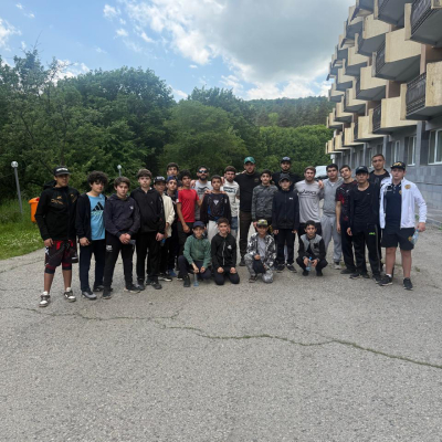 Group photo of young Armenian MMA athlete Mark Ghambaryan with freestyle wrestling champion Arsen Harutyunyan at the Tsaghkadzor training camp